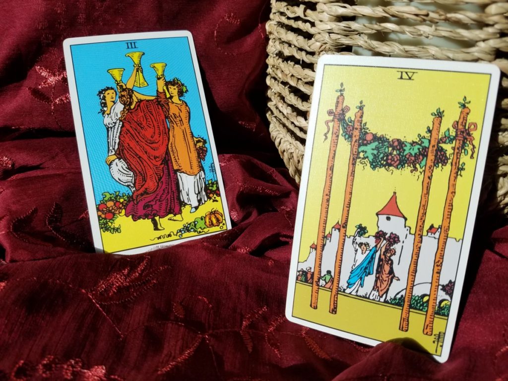 Tarot cards, 3 of cups, 4 of wands